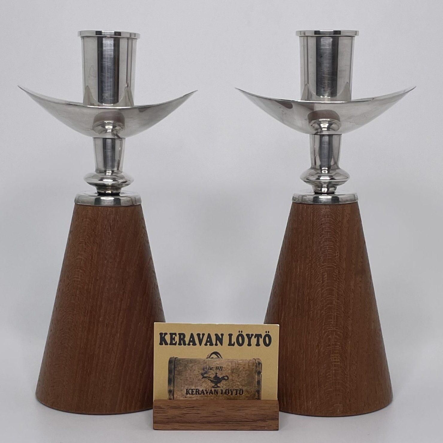 Anna-Greta Eker | Auran Kultaseppä Oy | Pair of silver 813H candlesticks with hardwood base | Signature